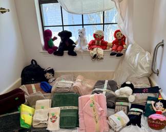 Towels and vintage stuffed toys. Raggedy Ann and Andy, Barney, etc.