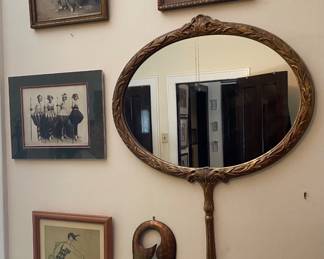 Wall Art including 2 Theatrical Photos, Swimming Lady Print and a Nude Women print, a metal safety pin, and an Over size Hand Mirror shape Mirror...Mirror is 36" tall x 23" Wide