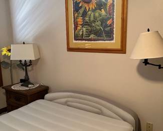 Air mattress, night stand, floor and table lamp, framed print - upstairs