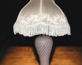 vintage Victorian-style boudoir table lamp featuring a swirled glass base and a detailed fabric fringe shade $165.00