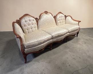 Louis XV style settee features a carved walnut frame and white tufted upholstery. $595.00