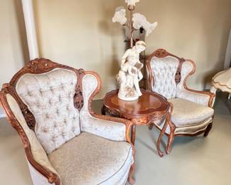 pair of French design wingback chairs features ornate carved love birds and angel faces $695.00