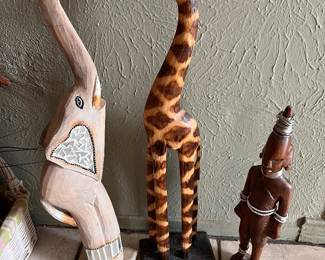 Handcrafted Wooden Elephant Statue with mirror mosaic inlay, Giraffe Figurine, & pair of vintage hand-carved African tribal sculptures.