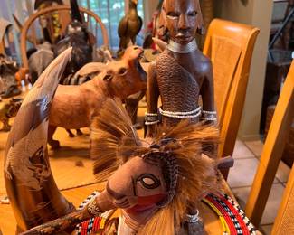 East African tribal woodcarvings, tribal artwork, and beaded collar necklace