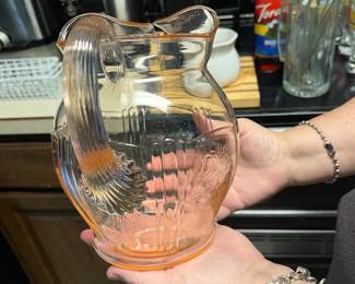 Pink paneled water pitcher from the MacBeth-Evans Glass Company American Sweetheart line .