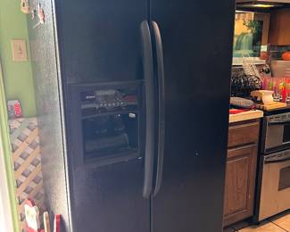 Whirlpool Black Side-by-Side Refrigerator with water/ice dispenser. Good condition, clean and fully functional.
