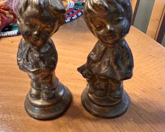 Vintage Goebel West Germany Bronze Boy and Girl - Description: Matching mid-century patinated bronze/metal sculptures featuring a charming young boy and girl in the classic Hummel artistic style. Manufacturer: Goebel (West Germany). Height: Approx. 5 inches tall. Condition: Excellent vintage condition with original aged patina.