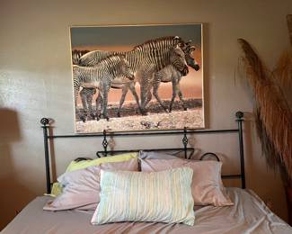 King-sized wrought iron metal headboard with scrollwork and king-sized bed including mattress and low profile box springs. Also pictured with large african safari decor "Zebras" oil on canvas painting by Anderson Design Group. 61" x 41"