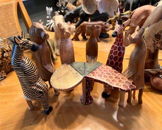 Wood Safari Party Animal Set includes a table shaped like the African continent, six animals, and 3 tiny wooden drinking cups.