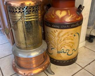 Painted milk cans and antique brass stove