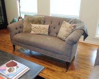 TUFTED BACK LOVESEAT ON LEGS