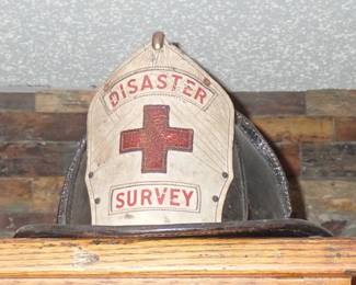 white leather front shield with a red cross emblem and the words "DISASTER SURVEY"