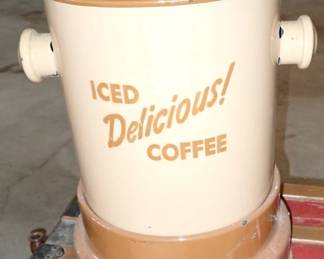 vintage mid-20th-century enamelware iced coffee dispenser, featuring a cream and brown two-tone body with "ICED Delicious! COFFEE" lettering