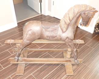 carved wooden glider rocking horse