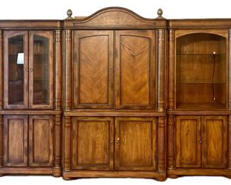 Ashley Furniture Millennium Collection Serengeti entertainment center featuring a three-part solid wood design with herringbone paneling •Center Media Cabinet 2 Pieces Overall 47w 25d 78"tall Bottom Center cabinet 31.5" tall •Side Glass Door Cabinet 1 piece Lighted 32wide 21deep 73tall •Side Open Glass Shelves Cabinet 1 piece Lighted 32wide 21deep 73tall