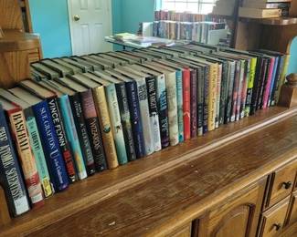 Books and Wooden Dresser and Mirror