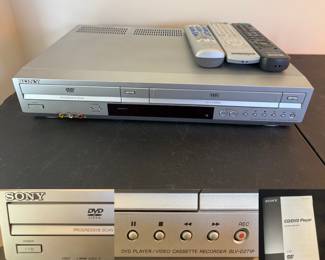  Sony SLV-D271P DVD/VCR combo player with silver finish and multiple remotes