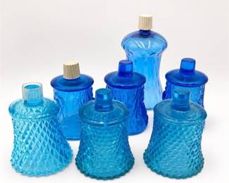Lot 558: 7 Blue Glass Peg Votive Cups, Hobnail & Diamond Point