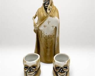 Lot 723: Porcelain Skeleton Poison Decanter with Two Skull Shot Cups