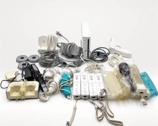Lot 561: Nintendo Wii Console with 4 Remotes, Games & Discgear Case