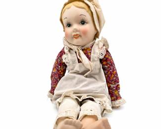 Lot 1029: Porcelain Character Doll with Cloth Body
