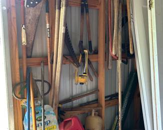 great selection of lawn and garden tools, long-handled yard tools, pruning tools, saws, rakes, shovels, garden supplies, watering equipment, and outdoor essentials
