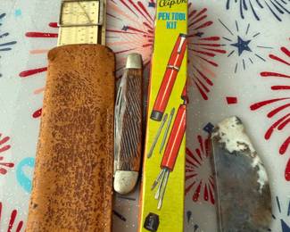 vintage slide rule, pen kit, pocket knife