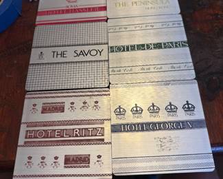 collection of drink coasters from ritz, the savoy, etc.