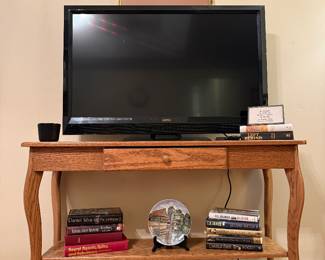 This is an ensemble comprised of a nicely framed art print, Vizio TV, and beautiful oak table. Plus some more great reads.
