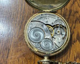 This timepiece features an Elgin Grade 303, Model 3 pocket watch movement, which completed production on February 27, 1925 based on serial number shown.