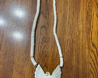This is a vintage Southwestern carved Mother of Pearl (MOP) bird necklace