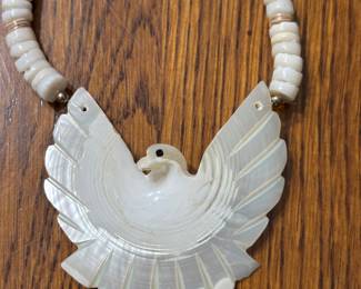 This is a vintage Southwestern carved Mother of Pearl (MOP) bird necklace