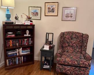 Books, prints and chair. Look closely at all the artwork. Some really nice pices.
