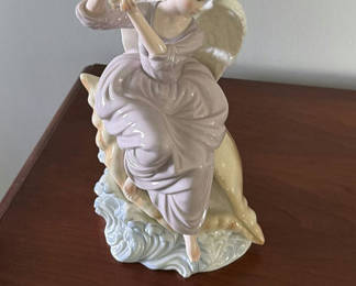 Lot 53: Porcelain Angel Figurine on Dolphin Base