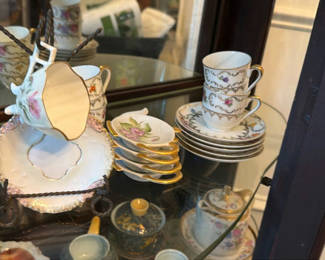 Lot 29: Floral Porcelain Teacups, Saucers, and Serving Pieces