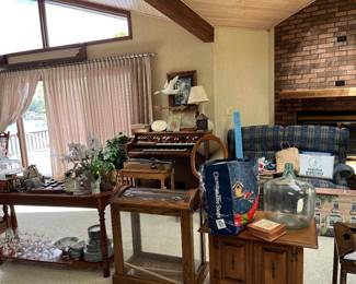 organ, end tables, coffee table, sofa table, big glass jug