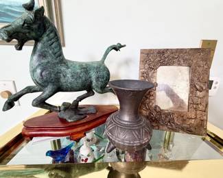 Various decor including a French Art Nouveau brass picture frame.