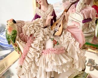 Dresden lady with harp and bird.
