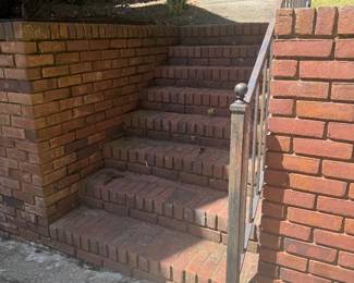 Steps from the lowest part of the driveway up to the house. Entry to the house will be through the garages. 