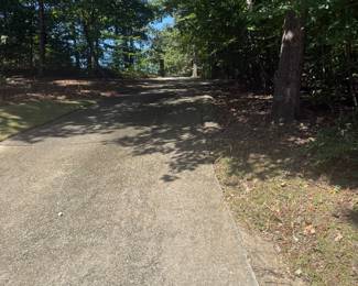 The driveway is very steep. The driveway will be used only for loading/unloading and dropping off buyers with mobility restraints and staff parking. 