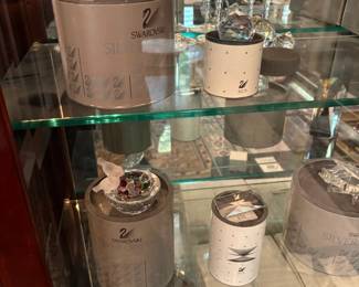 Swarovski crystal pieces with their original boxes