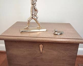 Small chest with brass door stop
