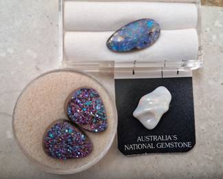 Large carved opal and boulder opal with exceptional blue and red.