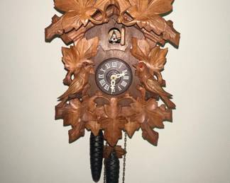 Black Forest Style Cuckoo Clock with Bird and Leaf Motifs