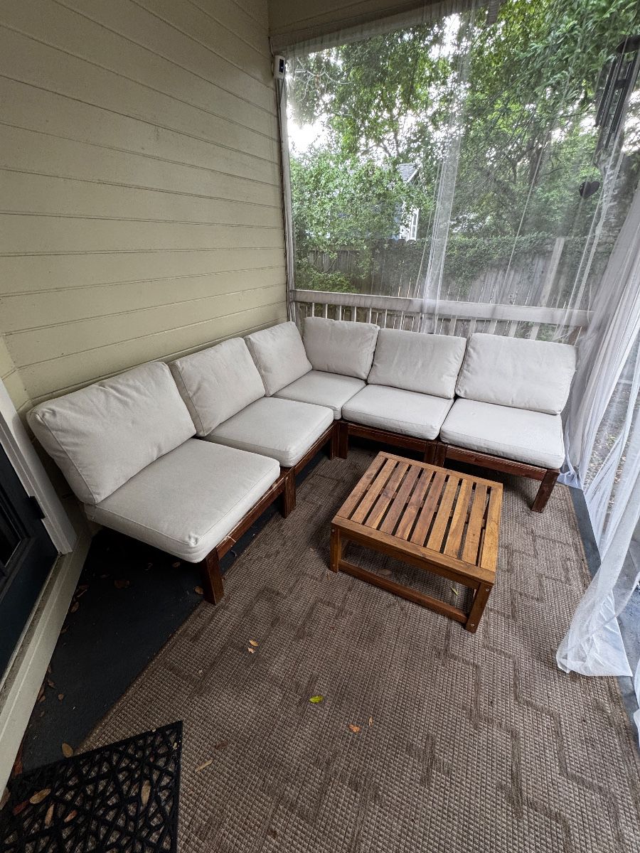Modern IKEA outdoor patio sectional with matching coffee table. Perfect for a screened porch, patio, or backyard entertaining.  • Modular sectional with matching coffee table • Washable cushion covers • Solid wood frame • Comfortable and sturdy • Great for outdoor or covered patio use • Some cushion covers have light dirt stains that did not come out in the wash (example shown in photo) • Structurally in great condition  Dimensions:  Patio Sectional: 76” L × 76” W × 32” H  Coffee Table: 25” L × 25” W × 12” H