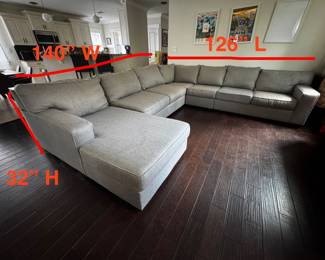 Beautiful light gray Ashley Furniture 5-piece U-shaped sectional with a pull-out queen sleeper and chaise lounge.  Originally retailed for $2,900  • Queen pull-out sleeper • Foam mattress topper included • 5-piece modular sectional • Light gray upholstery • Approx. 5 years old • Lightly worn and still in great shape • No tears, rips, or broken pieces • Very comfortable for everyday use and guests  Dimensions: 126” L × 140” W × 32” H