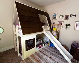 Kids House Loft Bed with Slide  Adorable house-style loft bed that turns bedtime into playtime! Features a cozy loft sleeping area, built-in ladder, attached slide, and open space underneath that’s perfect for a play area, reading nook, or toy storage.  Features:  * Twin-size loft bed * Charming house-frame design * Built-in ladder * Attached slide * Spacious play area underneath * Solid wood construction * Great condition with normal wear from use  Selling as part of an estate sale. Mattress, toys, décor, and accessories are not included.  Dimensions: Available upon request.  $450 OBO