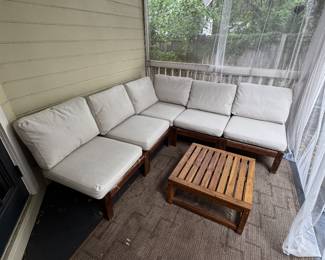 Modern IKEA outdoor patio sectional with matching coffee table. Perfect for a screened porch, patio, or backyard entertaining.  • Modular sectional with matching coffee table • Washable cushion covers • Solid wood frame • Comfortable and sturdy • Great for outdoor or covered patio use • Some cushion covers have light dirt stains that did not come out in the wash (example shown in photo) • Structurally in great condition  Dimensions:  Patio Sectional: 76” L × 76” W × 32” H  Coffee Table: 25” L × 25” W × 12” H