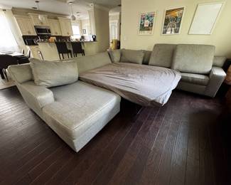 Beautiful light gray Ashley Furniture 5-piece U-shaped sectional with a pull-out queen sleeper and chaise lounge.  Originally retailed for $2,900  • Queen pull-out sleeper • Foam mattress topper included • 5-piece modular sectional • Light gray upholstery • Approx. 5 years old • Lightly worn and still in great shape • No tears, rips, or broken pieces • Very comfortable for everyday use and guests  Dimensions: 126” L × 140” W × 32” H