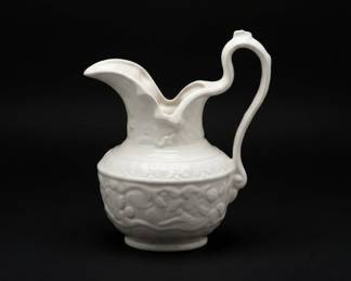 White Ceramic Pitcher with Embossed Floral Design and Matching Bowl